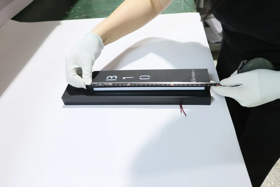 EZD worker checking product dimensions against project requirements