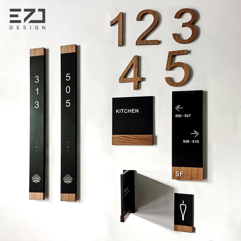 Coordinated black and wood-look hotel signage family