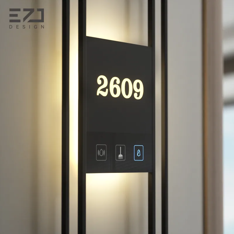Close view of a geometric black electronic hotel door sign and status symbols